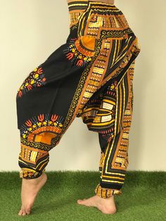 Dashiki Design, Harem Pants ,Handmade pants, Thick Smock Waist Low Crotch,Bohemian Harem cotton pants, African Dashiki Harem, Aladdin harem pants are very roomy, loose fitting and extremely comfortable. Elasticated both at the waist and ankle, with the crotch just below the knee. Bohemian Harem Unisex pants, Aladdin pants, Baggy Pants, Drop Crotch Pants. Dashiki pants, Yoga pants, Boho Hippi pants. *Fabric Type: Best Quality Fabric Cotton 100%. *Elastic Waist and around the ankle. *Quality sewin Casual Cotton Harem Pants With Boho Print, Traditional Harem Pants For Yoga, Handmade Cotton Bottoms For Festival, Handmade Cotton Festival Bottoms, Multicolor Cotton Harem Pants With Loose Fit, Traditional Multicolor Harem Pants With Elastic Waistband, Traditional Wide Leg Harem Pants For Yoga, Festival Cotton Pants With Elastic Waistband, Traditional Cotton Block Print Pants