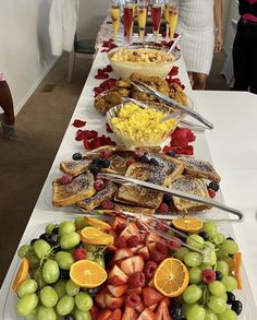 a long table filled with lots of different types of food