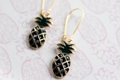 Pineapples are sign of welcome and they are fun earrings. We love pineapples so we adding them into our collection. Charm is paired with a gold plated kidney hook We use hypoallergenic, nickel free gold plated kidney hook to complete these earrings.  Measurement: 2.5 inches long  Each pair of earrings will arrive gift wrapped in a box finished with a ribbon. Pineapple Earrings, Fun Earrings, In A Box, Gold Finish, Jewelry Earrings Dangle, Pineapple, Dangle Earrings, Gold Plate, Jewelry Earrings