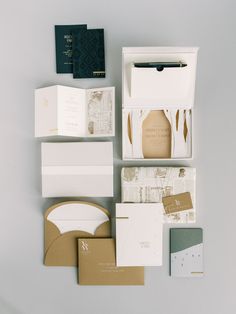 an assortment of stationery items including envelopes, cards, and other personal items