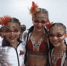 three girls in costume posing for the camera