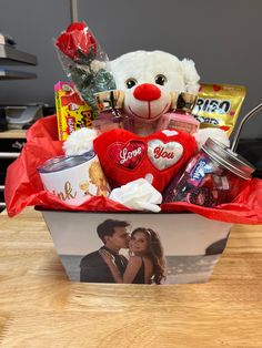 a valentine's day gift basket with a teddy bear