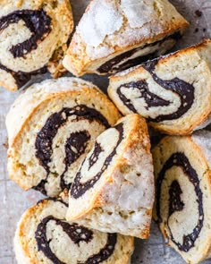 a pile of cinnamon rolls sitting on top of a table