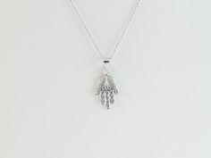 "Fabulous 14k Solid White Gold Hamsa Hand Of God Necklace!! Material: 14k gold , Not plate or filled Cable Chain: 14\",16\", 18\" , 20\" long by 0.7 mm thick Hamsa size: 5/8\" long by 3/8\" wide or 17 x11 mm Length and average length: 14\"= 1.80 grams 16\"= 1.90 grams 18\"= 2.00 grams 20\"= 2.10 grams Closure: Lobster clasp Gift box included The hand charm is smaller than a dime size. Images may be enlarged to show detail and the item may look larger than it appears in person.In order to reduce Hand-strung Spiritual Necklaces For Puja, Hamsa And Star Of David Necklace, Hand Of Fatima Jewelry, Hamsa Necklace Silver, Hamsa Hand Pendant, Gold Heart Locket, Engraved Locket, Gold Hamsa, Small Charms