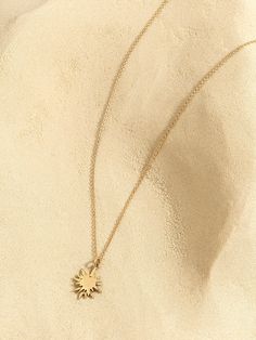 "Small sun necklace - a delicate and dainty 14k gold sun necklace. This unique solid gold celestial sunshine necklace is perfect solid gold jewelry to add a sparkling touch to your outfit. This 14k gold sun necklace with a starburst pendant would make a unique gift for a mom or a nature lover friend. The sun is a unified symbol across religions and cultures. It symbolizes the divine, birth, and healing. This unique sun necklace is delicate enough to wear as an everyday necklace, or as a stacked Gold Sun Necklace, Gold Schmuck, Sunshine Necklace, Sun Necklace, Celestial Necklace, Solid Gold Necklace, Gold Sun, Necklace Unique, Everyday Necklace