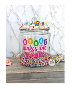 a glass jar filled with lots of sprinkles