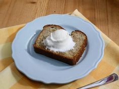 a piece of bread on a plate with whipped cream