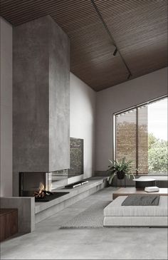 a modern living room with concrete walls and flooring