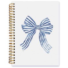 a spiral notebook with a blue and white striped bow on it