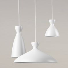 three white vases are hanging from the ceiling