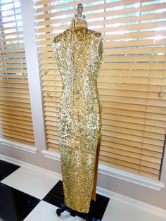 "This is an AMAZING oriental vintage gown fully embellished with bright gold sequins and accented with red, pink, green, silver and blue sequins and beading in an amazing abstract bird design. It's in absolutely PERFECT condition! Measurements: Bust - 34\" Waist - 28\" Hips - 36\" Dress Length - 55\" Side Slits - 28\" long This dress comes from a pet-free and smoke-free home. If you would like more info or have any questions, please ask!" Gold Gown With Gold Embroidery For Gala, Gold Wedding Gown For Holiday Season, Gold Wedding Gown For Holiday, Gold Holiday Gown, Holiday Festive Gown With Sequins, Festive Holiday Gown With Sequins, Gold Sleeveless Evening Dress For Festive Occasions, Gold Sequin Dress With Contrast Sequin For Festive Season, Holiday Festive Evening Dress With Sequins