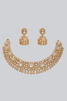 Gold Finish Elegant Kundan Polki Necklace Set Zevar By Geeta - Fabilicious Fashion Gold Kundan Bridal Necklace For Celebrations, Elegant Chandbali Kundan Necklace, Elegant Chandbali Kundan Necklace With Jewels, Elegant Jeweled Kundan Chandbali Necklace, Elegant Bollywood Kundan Necklace, Bollywood Style Elegant Kundan Necklace, Gold Temple Jewelry Sets For Reception, Elegant Jeweled Temple Necklace In Chandbali Style, Elegant Jeweled Chandbali Temple Necklace