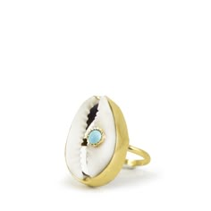 A reminder that sunny days are on the horizon, this ring is carefully handcrafted from 18k gold over silver featuring a cowry marked with a turquoise bead. Style it with its matching layered necklace from the Marina collection. Handmade from 18-karat Yellow Gold Over Sterling Silver (1 micron plating). We suggest to avoid contacts with soaps, detergents, chlorine and any other chemical substance that could alter the original characteristics of your jewel. When it is not worn, keep your jewelry p Unique Gold Jewelry For Vacation, Bohemian Oval Jewelry For The Beach, Bohemian Oval Jewelry For Beach, Unique Turquoise Jewelry For Vacation, Handmade Oval Jewelry For Beach, Blue Topaz Bracelet, Shell Ring, Italian Jewelry, Chunky Jewelry