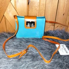 Genuine Italian Leather. It Is New With Tag But It Does Show Some Creasing , As Shown In Pictures . The Tag Was Pulled Off By Accident So It Was Taped . Brown Leather-handled Crossbody Box Bag, Chic Light Blue Leather Bag, Turquoise Leather Everyday Shoulder Bag, Light Blue Leather Satchel For Everyday Use, Chic Light Blue Leather Shoulder Bag, Turquoise Leather Shoulder Bag For Travel, Turquoise Shoulder Bag For Everyday Use, Chic Blue Flap Bag For Travel, On-the-go Blue Rectangular Satchel