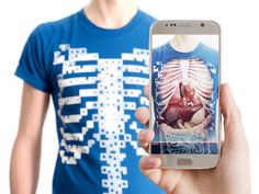 a person holding up a cell phone with an image of a human torso on it