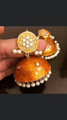 Don't miss out our beautiful and trendy meena kundan jhumka! We make them for you with love❤️ Lightweight colors available Ferozi , black, blue, white, red, green, orange Pre-order and shipping time 4-6 weeks. Handmade Gold Jhumkas For Festive Occasions, Handmade Gold Kundan Bridal Earrings, Elegant Jhumkas With Gota Work For Parties, Handmade Gold Plated Danglers For Wedding, Gold-plated Chandbali Jhumkas As Gift, Metal Chandbalis With Tilla For Wedding, Festive Gota Work Jhumkas For Party, Traditional Chandbalis With Mirror Work For Party, Bollywood Style Jhumkas With Gota Work For Festivals