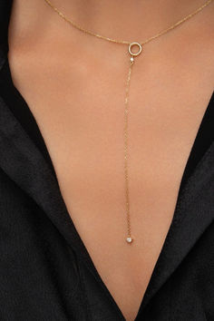 Introducing your next everyday favorite: a Circle Lariat Y Necklace with Diamonds. Featuring a 10cm chain and two round-cut diamonds in a modern lariat design, this 14k gold necklace is destined to take center stage in all your V-neck outfits and win the game of impressions! Elegant Diamond Lariat Necklace With Delicate Chain, Dainty Diamond Backdrop Necklace With Adjustable Chain, Elegant 14k Gold Lariat Diamond Necklace, Everyday Luxury Yellow Gold Lariat Jewelry, Gold Diamond Lariat Drop Necklace, Adjustable Diamond Lariat Jewelry, Adjustable Lariat Diamond Jewelry, Gold Lariat Jewelry With Single Cut Diamonds, Elegant Lariat Necklace With Adjustable Diamond Chain