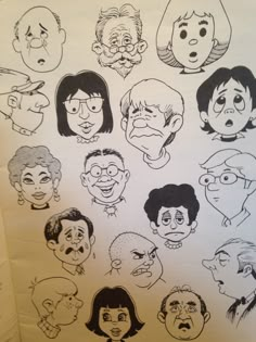 a bunch of cartoon faces drawn on a piece of paper