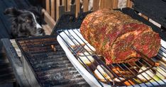 a large piece of meat cooking on top of a grill