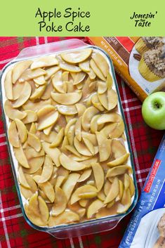 an apple spice poke cake in a glass baking dish next to some apples and other snacks