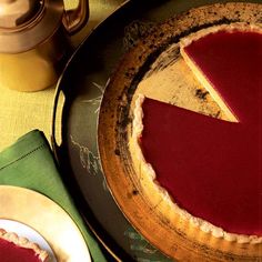 a piece of pie sitting on top of a wooden plate