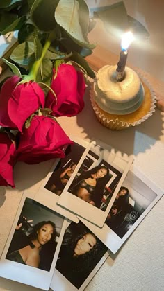 three polaroid photos and a single candle on a table with red roses in the foreground