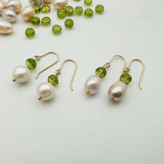 Pearl earrings gold,Periodot earrings gold filled,14 ct goldfilled earrings, peridot pearls,Gemstone earrings,minimalist pearls earrings  Beautiful earrings made of fresh water  Pearl and peridot with 14ct goldfilled Beautiful design and an elegant contrast of white and green. Size: 8 mm pearl with 6mm 14k Gold-filled Pear-shaped Pearl Drop Jewelry, Elegant Hypoallergenic Green Jewelry, Elegant Green Hypoallergenic Jewelry, Nickel-free Yellow Gold May Birthstone Jewelry, Nickel-free Yellow Gold Jewelry For May Birthstone, Nickel Free Yellow Gold Jewelry For May Birthstone, Gold Peridot Earrings Fine Jewelry, 14k Gold Filled Pear-shaped Pearl Drop Jewelry, Minimalist Dangle May Birthstone Jewelry