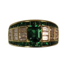 Picchiotti 18K yellow gold ring set in center with one square emerald cut emerald weighing .89cts, surrounded by 34 square emeralds weighing 1.07cts and 22 baguette diamonds weighing 1.20cts, F-G color, VS clarity. Finger size 6.5, may be sized Formal Rectangular Emerald Diamond Ring, Rectangular Emerald Diamond Ring For Formal Occasions, Classic Green Emerald Ring With Baguette Diamonds, Rectangular Emerald Ring With Baguette Diamonds For Formal Occasions, Rectangular Emerald Ring With Baguette Diamonds For Formal Events, Formal Emerald Ring With Baguette Diamonds, Classic Green Diamond Ring With Baguette Diamonds, Green Emerald Cut Emerald Ring With Baguette Diamonds, Classic Green Rectangular Diamond Ring