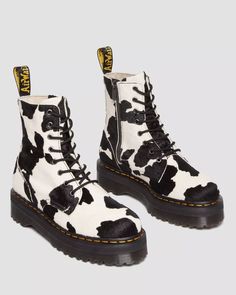 Don't fade into the background. Show off your style with this standout version of the Jadon boot, made of statement-making Cow Print Hair On leather. Featuring our signature Quad sole with grooved detailing and yellow welt stitch, plus black laces, an inside zip, and a black-and-yellow heel loop. The Jadon boot upgrades the 8-eye boot to a whole new level. Look more statuesque and feel more daring - Hair On is an all-natural printed material made with real hair and leather. Plus, it stands highe Cow Boots, Jadon Boots, Dr Martens Jadon, Boot Stand, Fashion Masks, Yellow Heels, Fur Accessories, Walk In My Shoes, Tripp Nyc