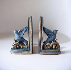 two blue bird bookends sitting next to each other