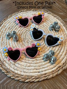 "Fun heart-shaped sunglasses with flowers in the corners are perfect for any bachelorette Party, Birthday Party, or any day out! These are handmade in two color options white or pink. *Note that sunglasses will have different combinations of flowers on each pair of sunglasses.  IMPORTANT:  One pair of sunglasses is included, Buy 5 or more and save 10% with coupon code \"PARTY10\"" Cute Party Sunglasses With Tinted Lenses, Cute Adjustable Sunglasses For Parties, Cute Heart Shaped Sunglasses For Spring, Spring Gift Sunglasses With Tinted Lenses, Cute Sunglasses For Spring As A Gift, Spring Gift Sunglasses With Adjustable Fit, Spring Gift Adjustable Sunglasses, Playful Adjustable Sunglasses For Parties, Cute Spring Sunglasses As Gift