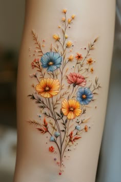 a woman's thigh with flowers painted on it