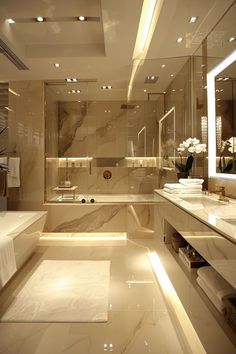 a large bathroom with two sinks and a bathtub in the middle, along with a long counter