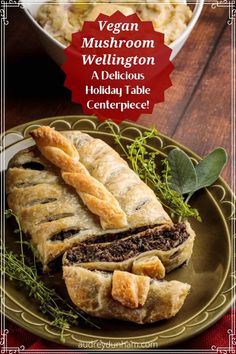 vegan mushroom wellington with a delicious holiday table centerpiece on a green plate next to a bowl of macaroni and cheese