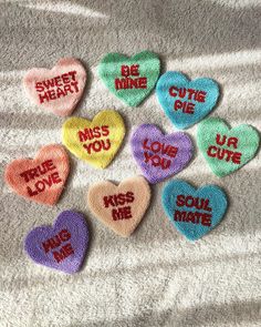 six conversation hearts with the words'be mine'and'miss you'written on them