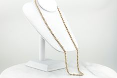 This gorgeous, vintage gold chain has a warm, textured sheen that is both eye catching and regal! Intricately woven knots of polished gold cascade beautifully down the neck and the smooth links feel luxurious against the skin! This is a beautiful piece to wear alone or it could be combined with a large pendant to transform into an outstanding statement piece! Metal: 14K Yellow Gold Width of Chain: 4.2 mm Length of Chain: 28 Inches Marks: "14K" Stamped on the clasp Elegant Formal Gold Chain Rope Necklace, Elegant Formal Gold Rope Chain Necklace, Gold Rope Chain Link Necklace For Formal Occasions, Gold Link Rope Chain Necklace For Formal Occasions, Gold Rope Chain Necklace For Formal Events, Gold Rope Chain Necklace For Formal Occasions, Elegant Gold Rope Chain Necklace For Formal Occasions, Formal Rope Chain Necklace, Formal Gold Rope Chain Link Necklace