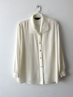 80s Women's formal blouse Pale Champagne sheer blouse Ivory white long sleeve top Vintage grandma blouse with shoulder pads Size Extra large N.B. Real color might slightly differ from picture. Estimated size: XL Measurements: (lying flat) Length - 29"/ 73.5 cm Shoulders:  17"/ 43.3 cm Sleeve - 24"/ 61 cm Pit to pit: 24"/ 61 cm Waist: 24"/ 61 cm Please check measurements to insure a proper fit. Remember to allow yourself some extra room for movement. You can compare these with something from your Classic Long Sleeve Top For Spring Workwear, Cream Long Sleeve Tops For Work, Feminine Long Sleeve Formal Tops, Elegant Long Sleeve Top With Sheer Sleeves, Spring Collared Top With Sheer Sleeves, Feminine Long Sleeve Tops For Formal Occasions, Classic Office Tops With Sheer Sleeves, Classic Sheer Sleeve Tops For Office, Vintage Long Sleeve Padded Blouse