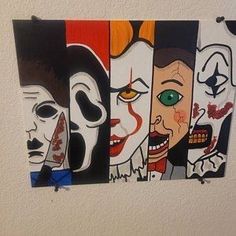 four pieces of art hanging on the wall with different faces painted on each one piece