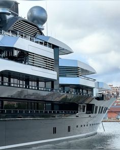 a large silver boat is in the water