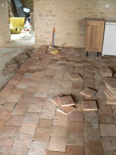 a room that has some bricks on the floor