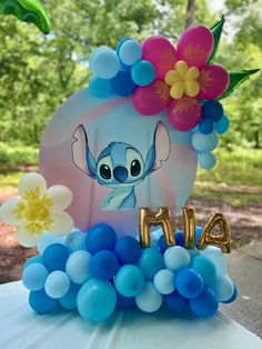 the balloon decoration is made to look like an elephant with flowers on it's head