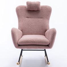 a pink chair sitting on top of a wooden frame