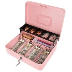 an open pink briefcase filled with lots of money and key to the top of it