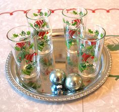 Brighten your holiday table with these wonderfully colorful vintage barware (which could double as tumblers, as needed). Featuring red and green bells with sprigs of holly and berries, these glasses, a 4-piece set, are so much fun! Two sets of 4 are available.  Each vintage glass measures 5" high x 2 3/4" diameter across the top, holding approx. 8 ounces of your favorite holiday cheer. Found in their original packaging at an estate sale near the Jersey Shore, these glasses are part of the Hazelw Holly Decor, Holiday Glassware, Holly Decorations, Creative Look, Holly And Berries, New Memories, Christmas Poinsettia, Vintage Bell, Vintage Barware