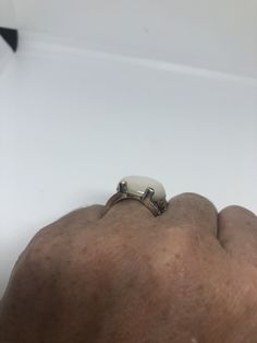 Mother of Pearl set in 925 Sterling Silver Marcasite ring I have size 5.75 Can be re sized for you, my jeweler would charge $10-$20 All rings are shipped in a nice gift box. Check out our over a THOUSAND great reviews Engraving is $4 per letter and is not always perfect depending on the piece. It can take a few days if the jeweler is busy. This is payable to Paypal Judithsltd@gmail.com White Nickel-free Rings For Anniversary, White Turquoise Ring For Anniversary, Unique White Ring With Accent Stones, Elegant White Ring With Large Stone, Elegant White Rings With Large Stone, Unique White Turquoise Ring As Gift, Unique White Rings With Accent Stones, White Hallmarked Sterling Silver Crystal Ring, White Sterling Silver Crystal Ring Fine Jewelry