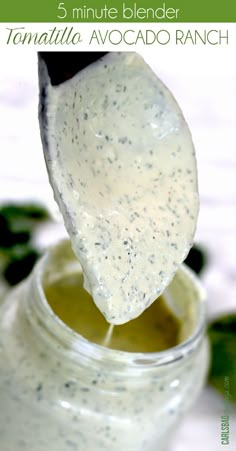 a spoon full of ranch dressing in a jar with the words 5 minute blender tamatilla avocado ranch