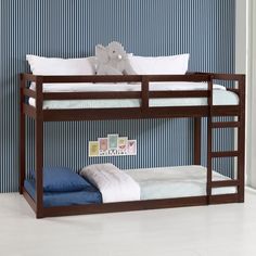 a bunk bed with blue and white striped wallpaper