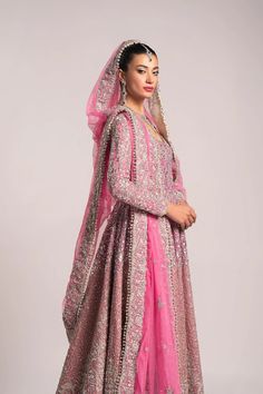 Pink Pakistani Bridal Dress in Pishwas Frock Style is embellished with beautiful zardosi, sequins, crystals, and embroidery work. Premium quality fabric and perfect stitching make this Pakistani Wedding Dress your foremost priority for the most important day of your life. Frock And Lehenga, Pink Pakistani Bridal Dress, Pakistani Walima Dress, Pishwas Pakistani, Bridal Pishwas, Pink Bridal Dress, Bridal Lehenga Pakistani, Nameera By Farooq, Dress Ethereal