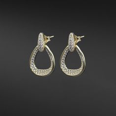 "Description: Introducing our exquisite Double Pear-Shaped Drop Earrings, a harmonious blend of elegance and craftsmanship. These captivating earrings showcase pear-shaped horseshoes that gracefully dangle from the earlobe, adorned with diamonds along the inside of the \"U\" and encased in a delicate gold frame. The top connecting piece is adorned with AAAA high-quality cubic zirconia stones, adding an extra touch of sparkle to these stunning earrings available in solid sterling silver or 14k go Formal Drop Hoop Earrings For Pierced Ears, Teardrop Pierced Earrings For Evening, Formal Teardrop Pierced Bridal Earrings, Formal Teardrop Bridal Earrings Pierced, Formal Teardrop Bridal Earrings, Elegant Teardrop Hoop Earrings For Pierced Ears, Formal Teardrop Hoop Earrings, Classic Teardrop Pierced Diamond Earrings, Classic Teardrop Diamond Earrings