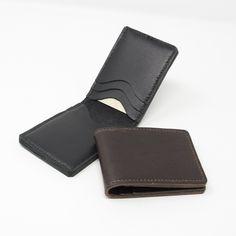 Leather bifold credit card holder with six individual card slots; choice of brown or black leather. This simple card holder is made from a combination of leathers.  The outer piece is a 2mm thick leather with a slightly textured finish.  The inner pockets are made from a thinner complimentary leather.  The card wallet is entirely hand-stitched using traditional saddle stitch and linen thread.  Edges are burnished to give a smooth finish.  Credit card holders measure approximately 213mm x 77mm op Black Bifold Card Holder, Classic Brown Trifold Card Holder, Brown Bifold Card Holder For Formal Use, Black Leather Card Holder With Id Window, Brown Business Card Holder With Id Window, Formal Brown Bifold Card Holder, Brown Card Holder With Id Window, Classic Brown Card Holder With Coin Pocket, Brown Bifold Card Holder With Coin Pocket